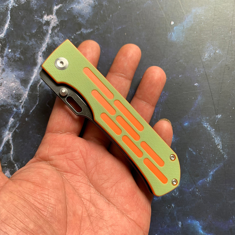 Reedus T1041A3 Black TiCn Coated and Stonewashed 154CM Blade Green and Orange G10 Handle with D.O.C.K. Design